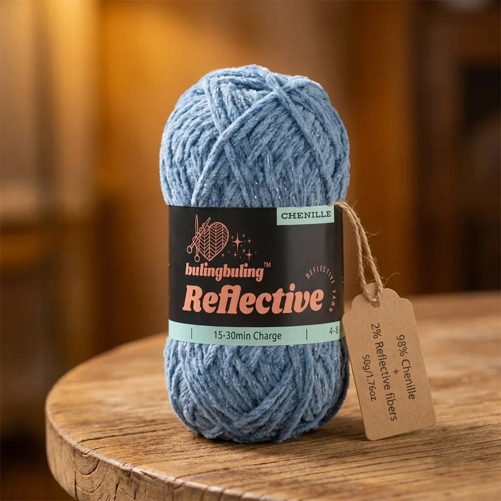 Blue reflective chenille yarn skein on a wooden table